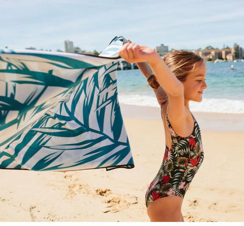 eco_friendly_beach_towel_88d9f8e9-47a0-402d-ae3e-ed21f6d7e8b2.jpg