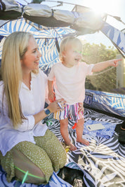 Happy baby in beach tent